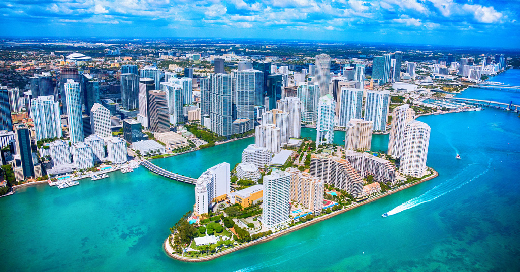 a large body of water with a city in the background