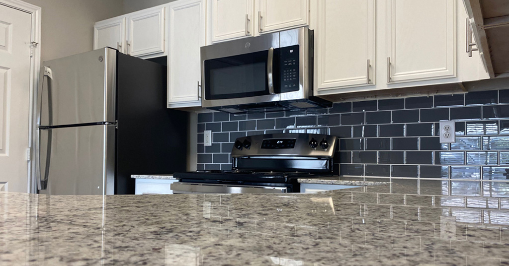 a kitchen with a stove and a microwave