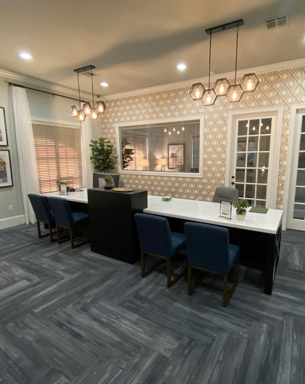 a living room filled with furniture and a large window