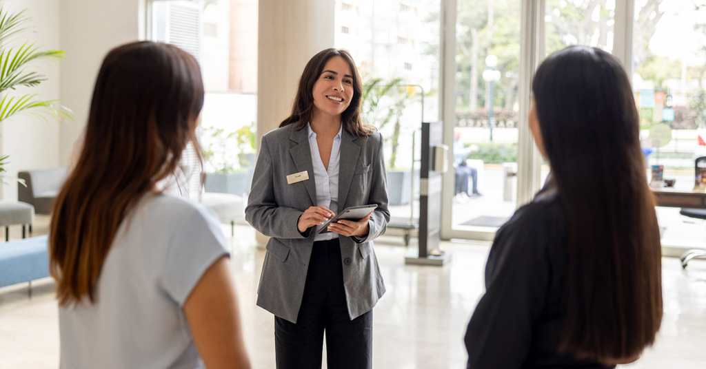 a woman standing in front of a window