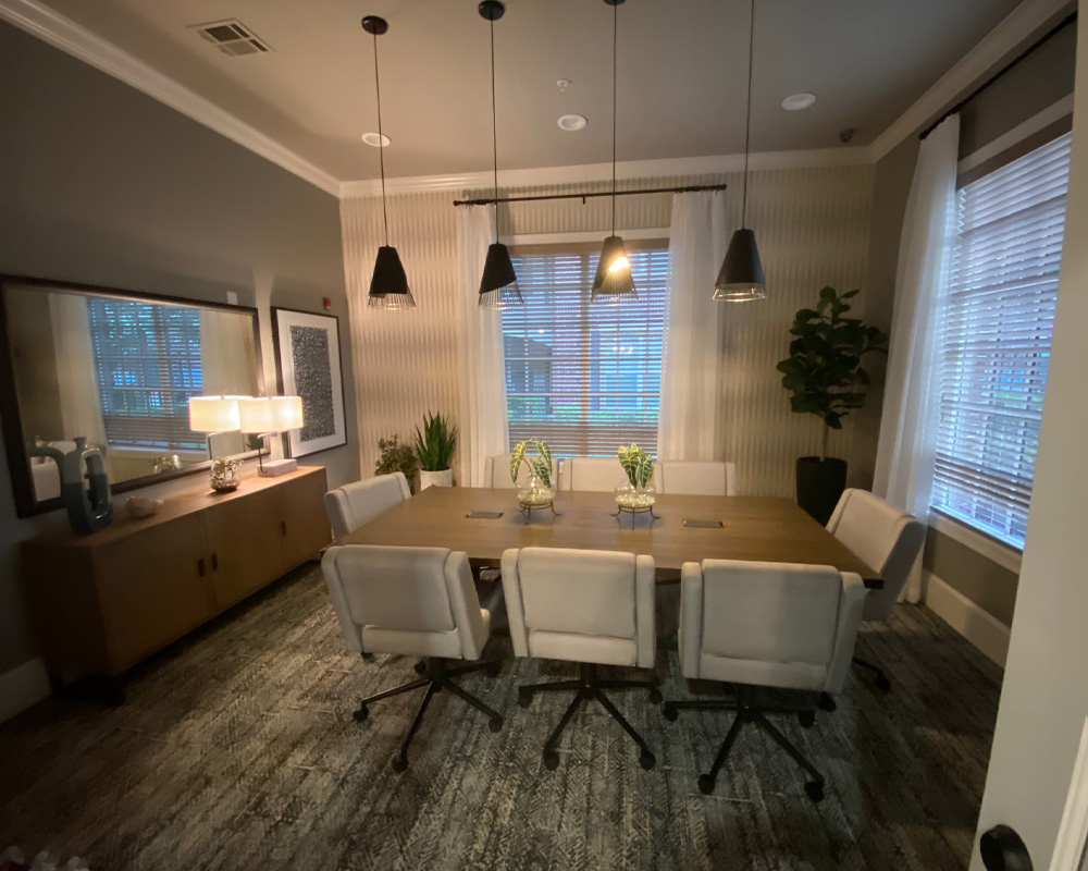 a room filled with furniture and a large window